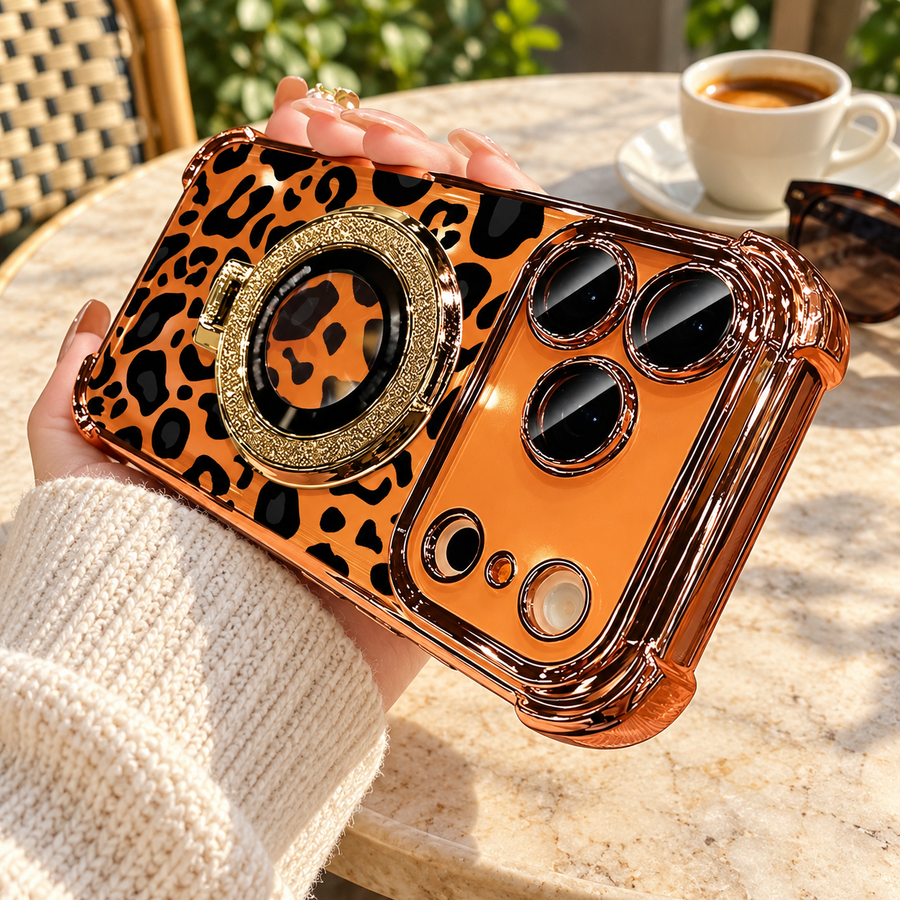 Warm gold leopard phone case held during a relaxed outdoor coffee break