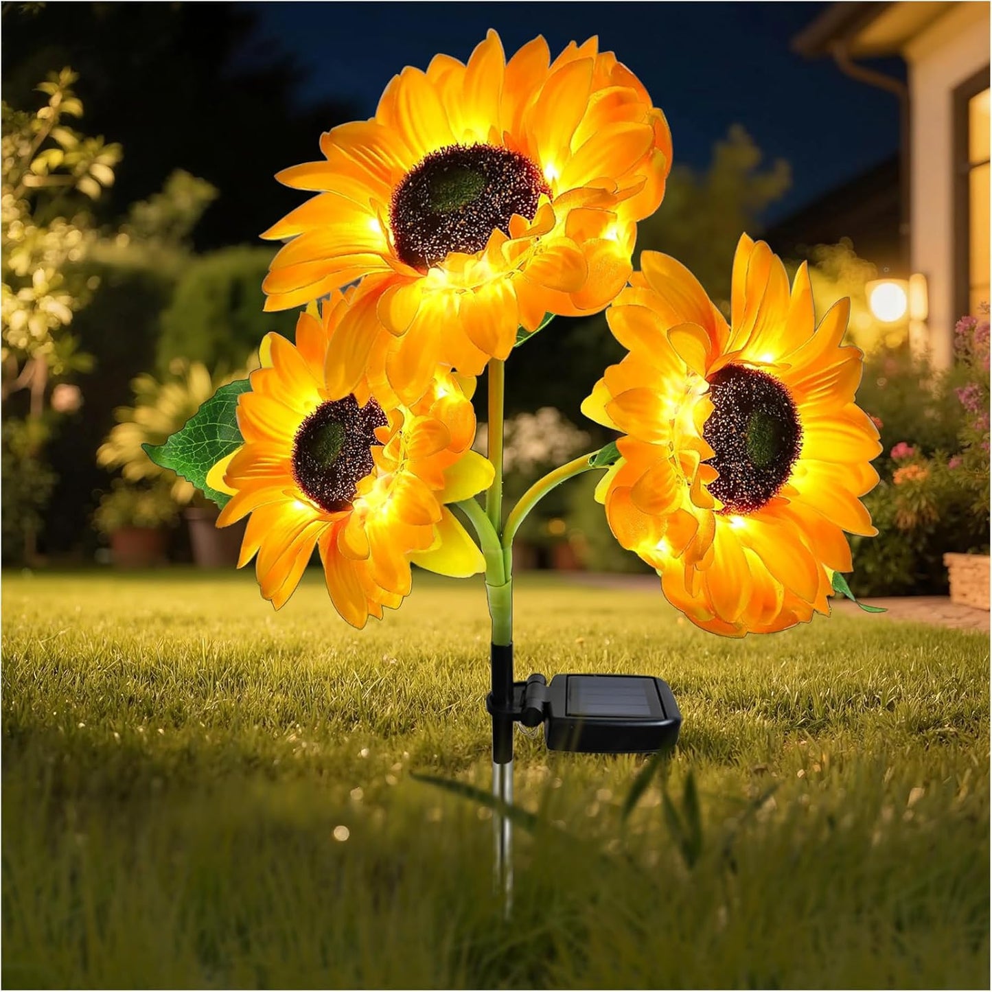 Solar sunflower garden light with three illuminated flower heads