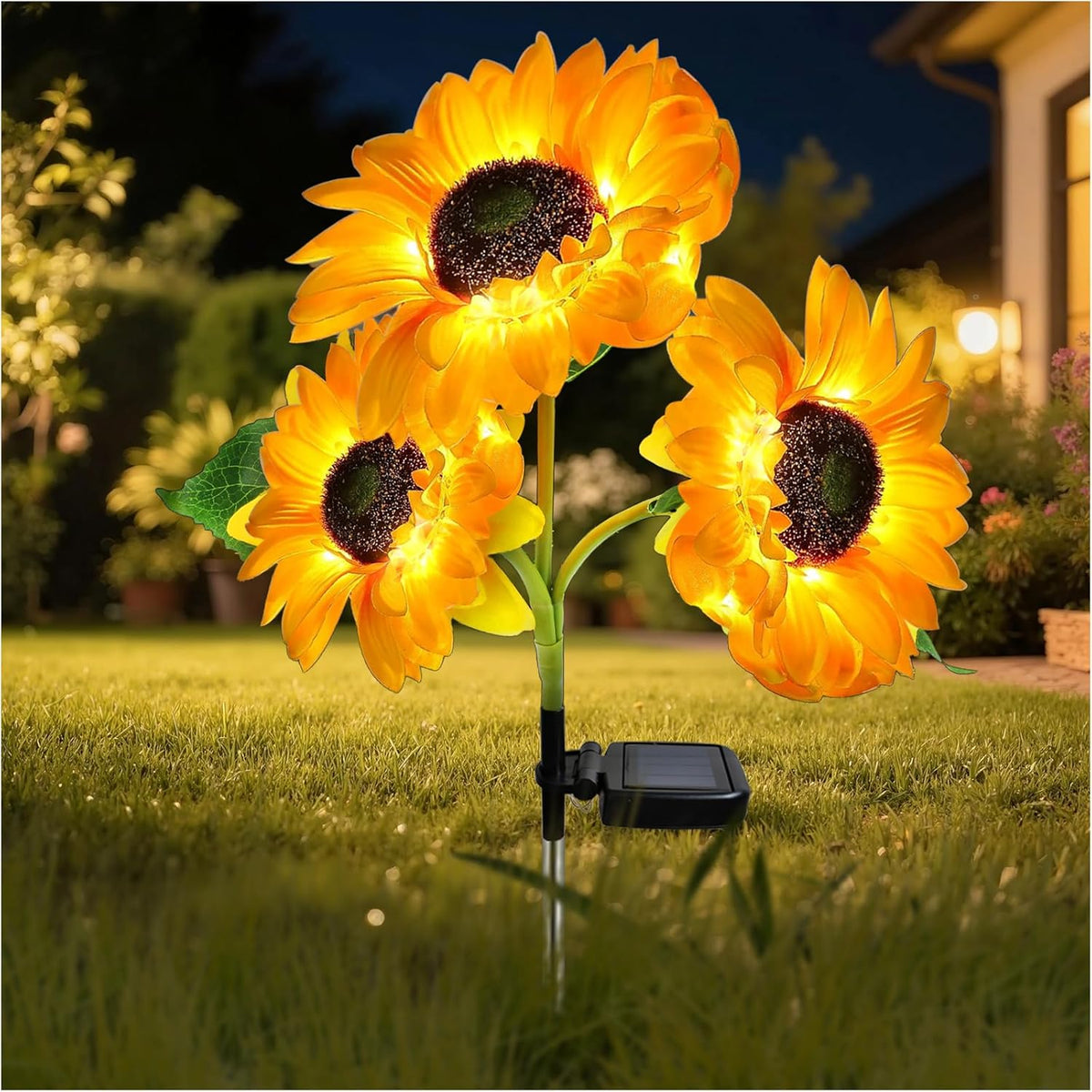 Solar sunflower garden light with three illuminated flower heads