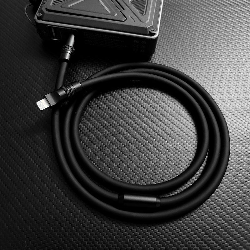 Lightning cable coiled and connected to a portable charger