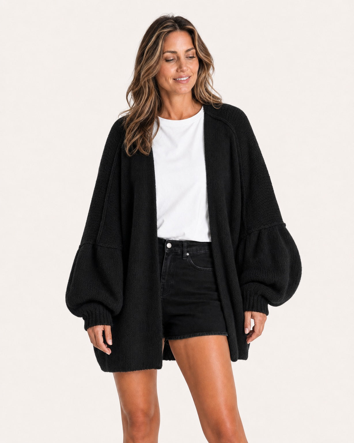 Black oversized open-front knit cardigan, front view on model